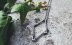 Bone Collector Pendant
