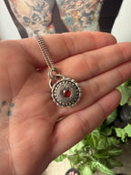 Sundial Pendant with Garnet