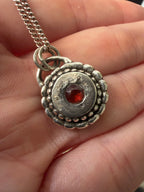 Sundial Pendant with Garnet