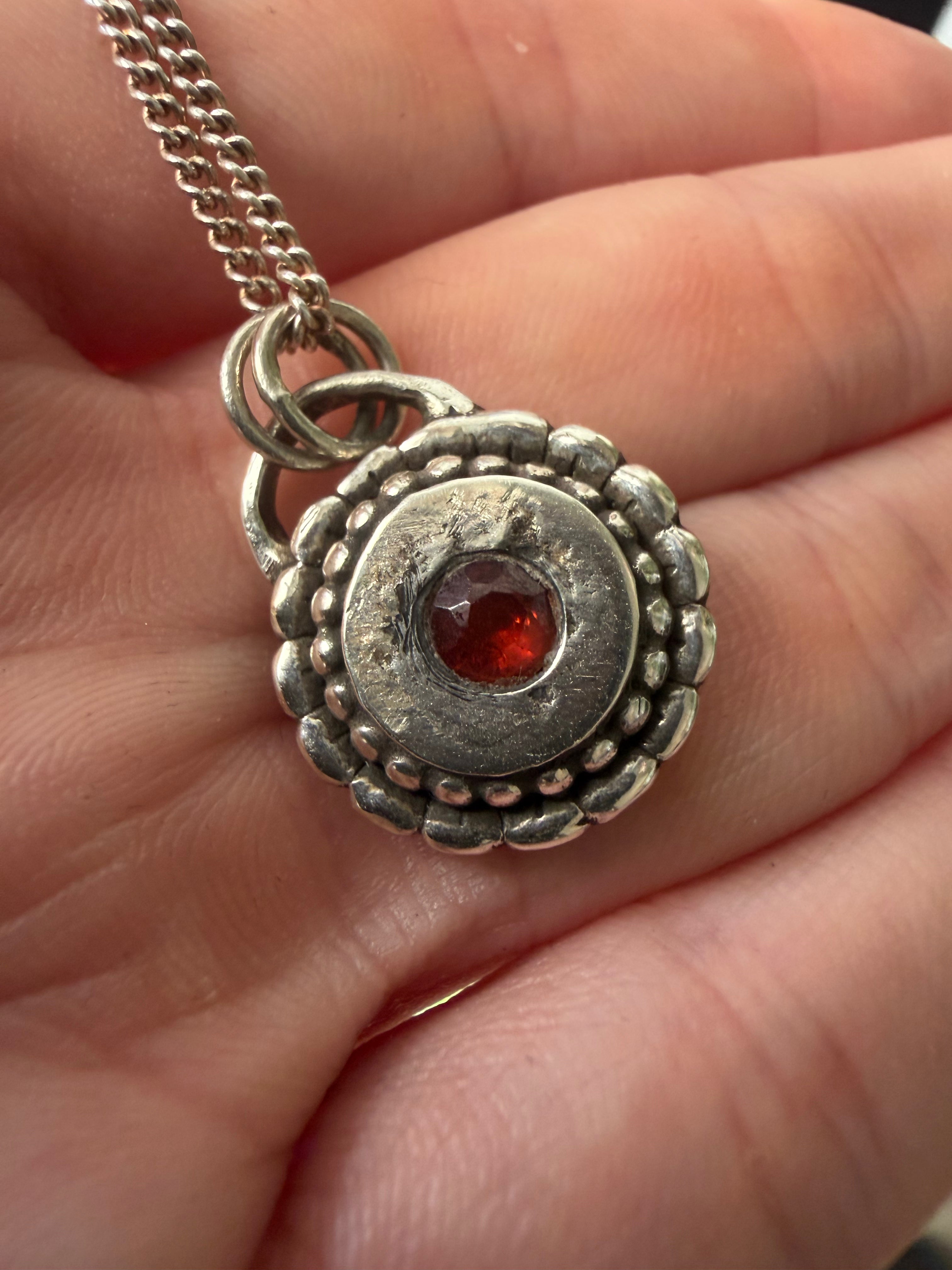 Sundial Pendant with Garnet