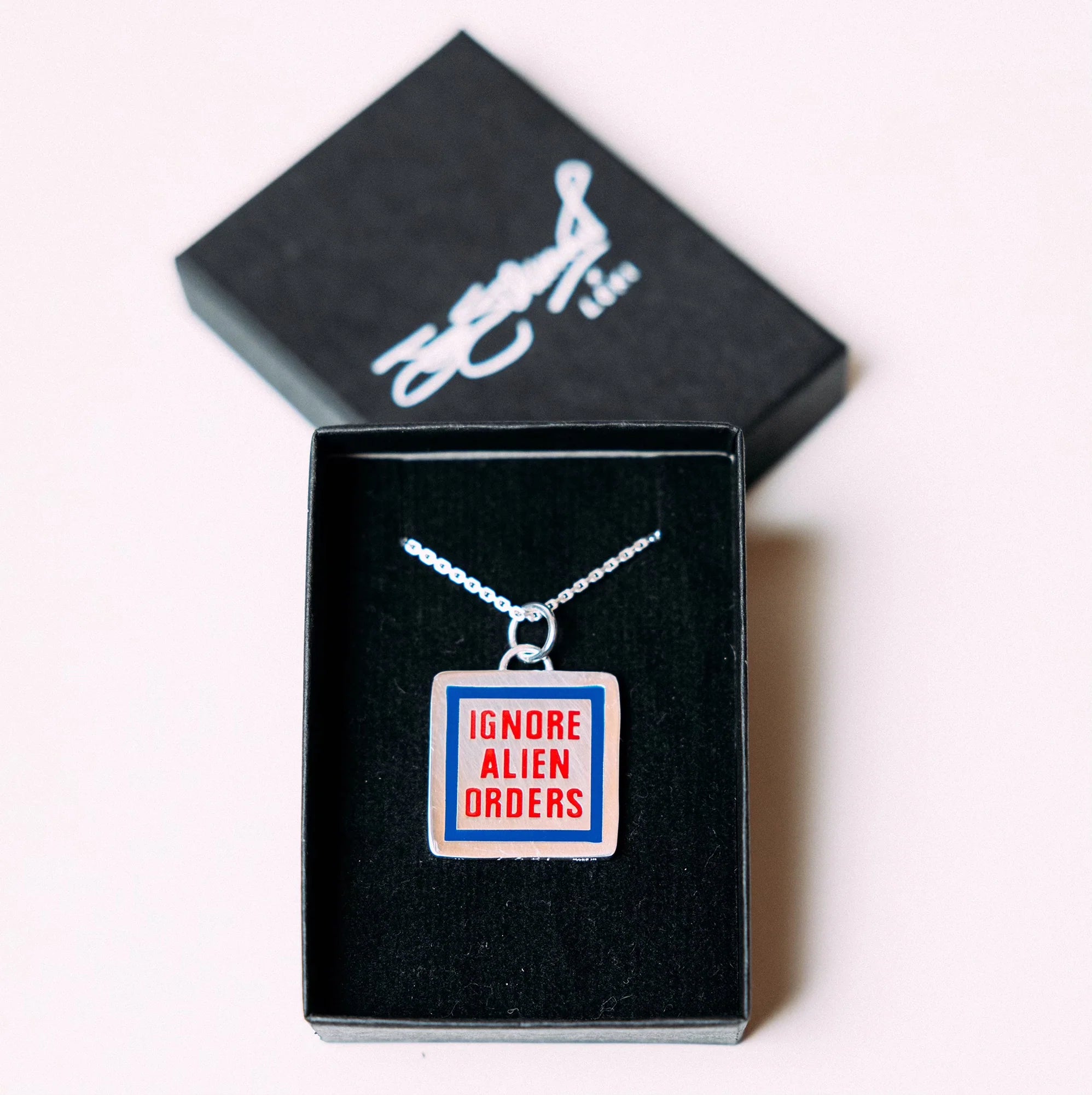 Official LOKI X JOE STRUMMER "Ignore Alien Orders" Necklace